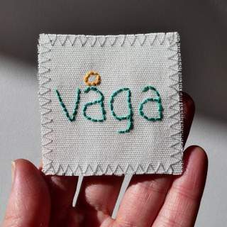 Hand embroidered Swedish word fabric patch.